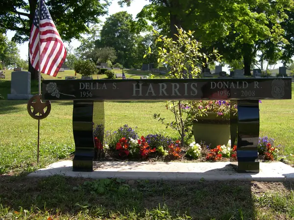 A granite memorial bench crafted by American Monument & Granite Co.
