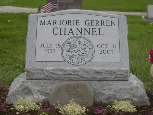 A slant granite marker crafted by American Monument & Granite Co.