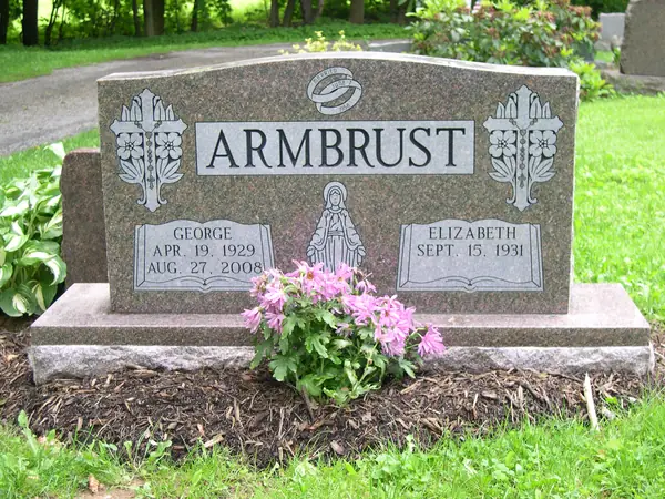 An upright granite monument crafted by American Monument & Granite Co.