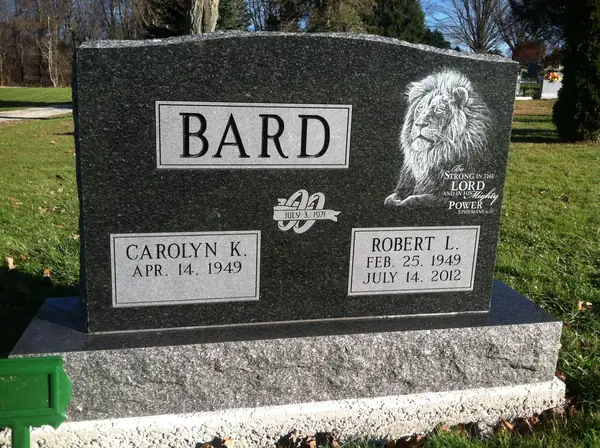 An upright granite monument crafted by American Monument & Granite Co.