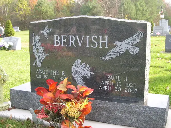 An upright granite monument crafted by American Monument & Granite Co.